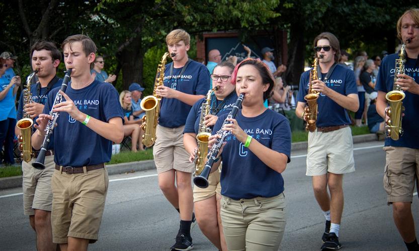Students celebrate while on a homecoming parade float